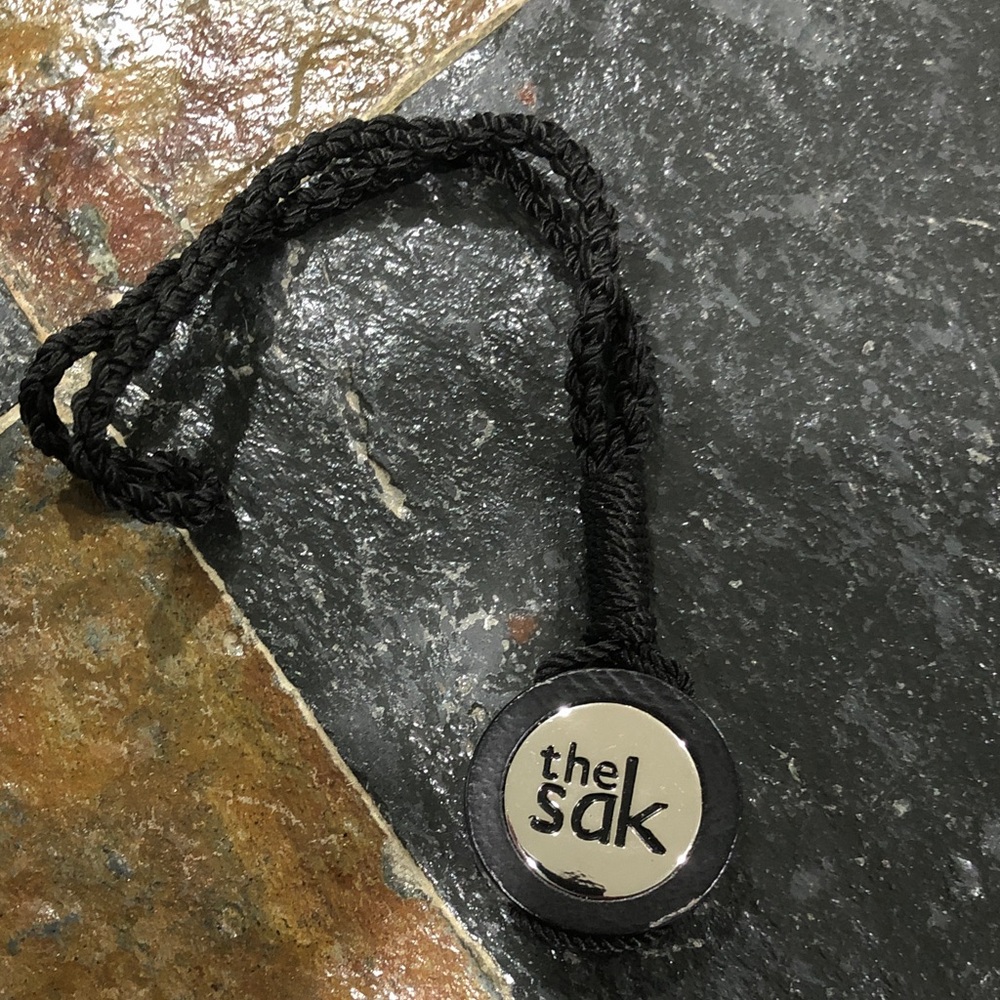 the sak key chain fob charm pendant tag brown rope metal wood hangtag part